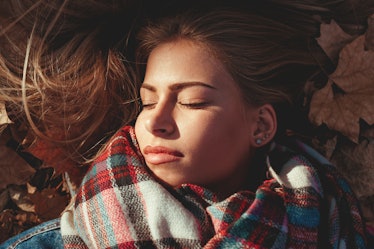 Young woman lying down in the park