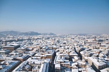 The city of Florence is sunny and snow-covered in the middle of winter.