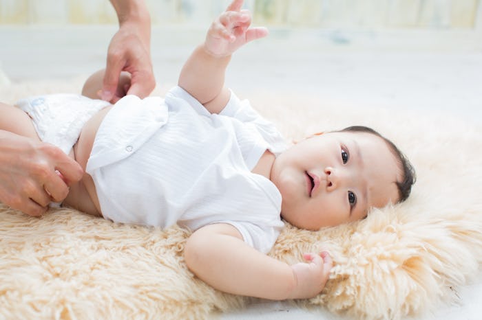 asian baby changing diaper