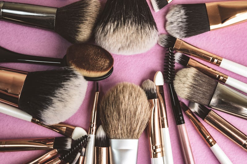 A set of beautiful different soft brushes for make-up from natural nap for beauty targeting and appl...