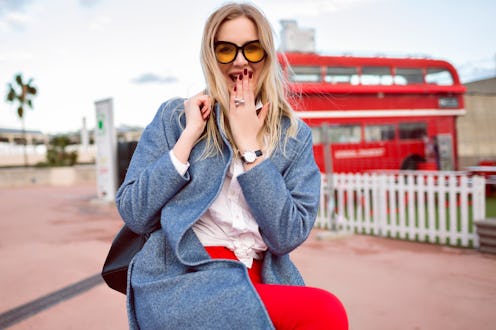 Close up city outdoor autumn spring mid season image of happy magnificent blonde exited woman smilin...