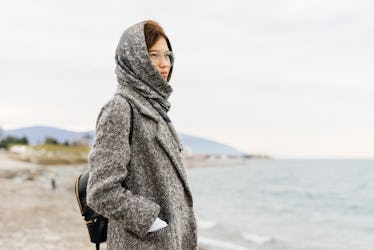 stylish young woman, possibly thinking of how to get over someone