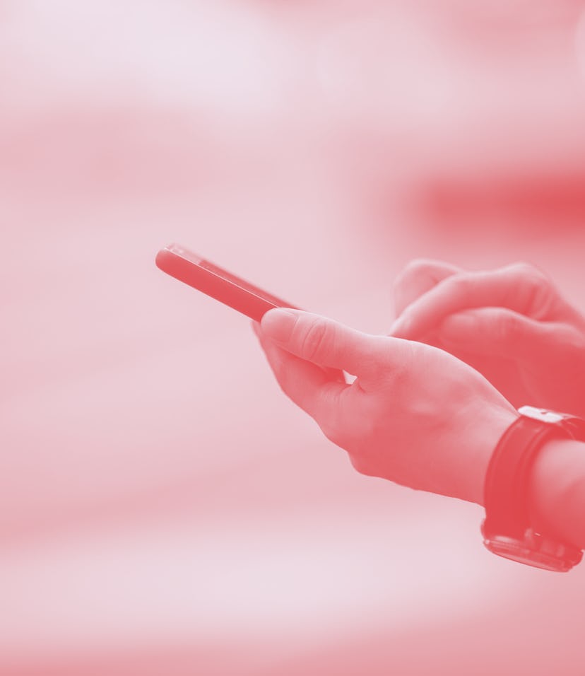 Woman hands using smartphone at city street side,checking the ride-hailing apps