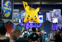 An inflated 'Pikachu' hangs over a crowd attending the 2019 Pokemon World Championships in Washingto...
