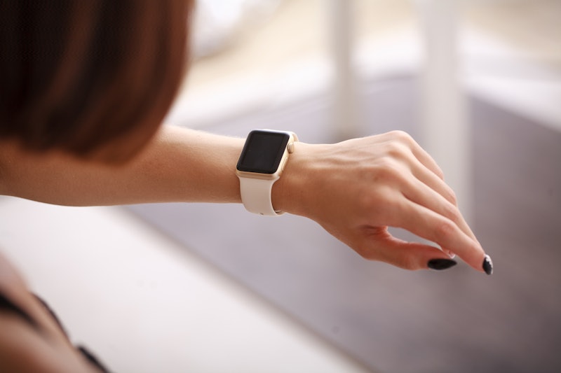 Woman using her smartwatch. Woman hand with smartwatch 