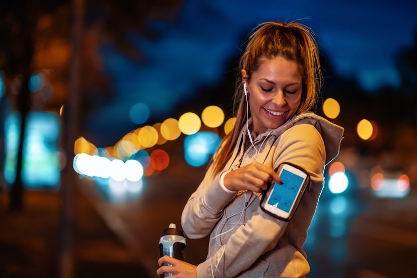 Young woman  running at night in the city.