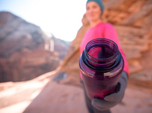 Purple Water Bottle Offer with extreme selective focus