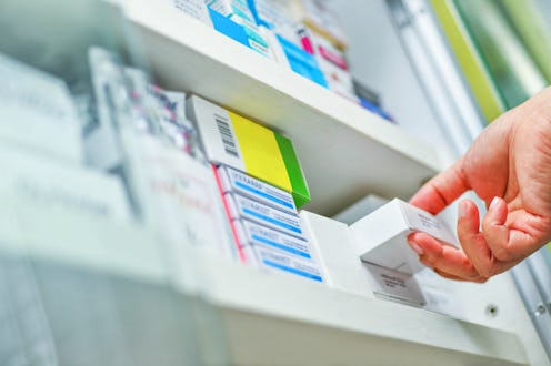 Closeup pharmacist hand holding medicine box in pharmacy drugstore. Here's what an expert wants you ...