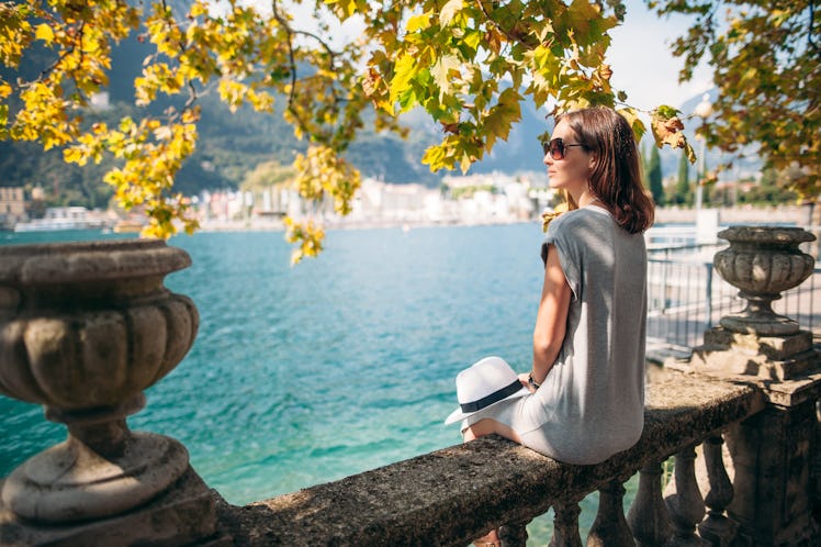 Young woman relaxing on beautiful Garda lake. vacation concept