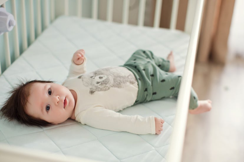 baby lying in crib for his nap