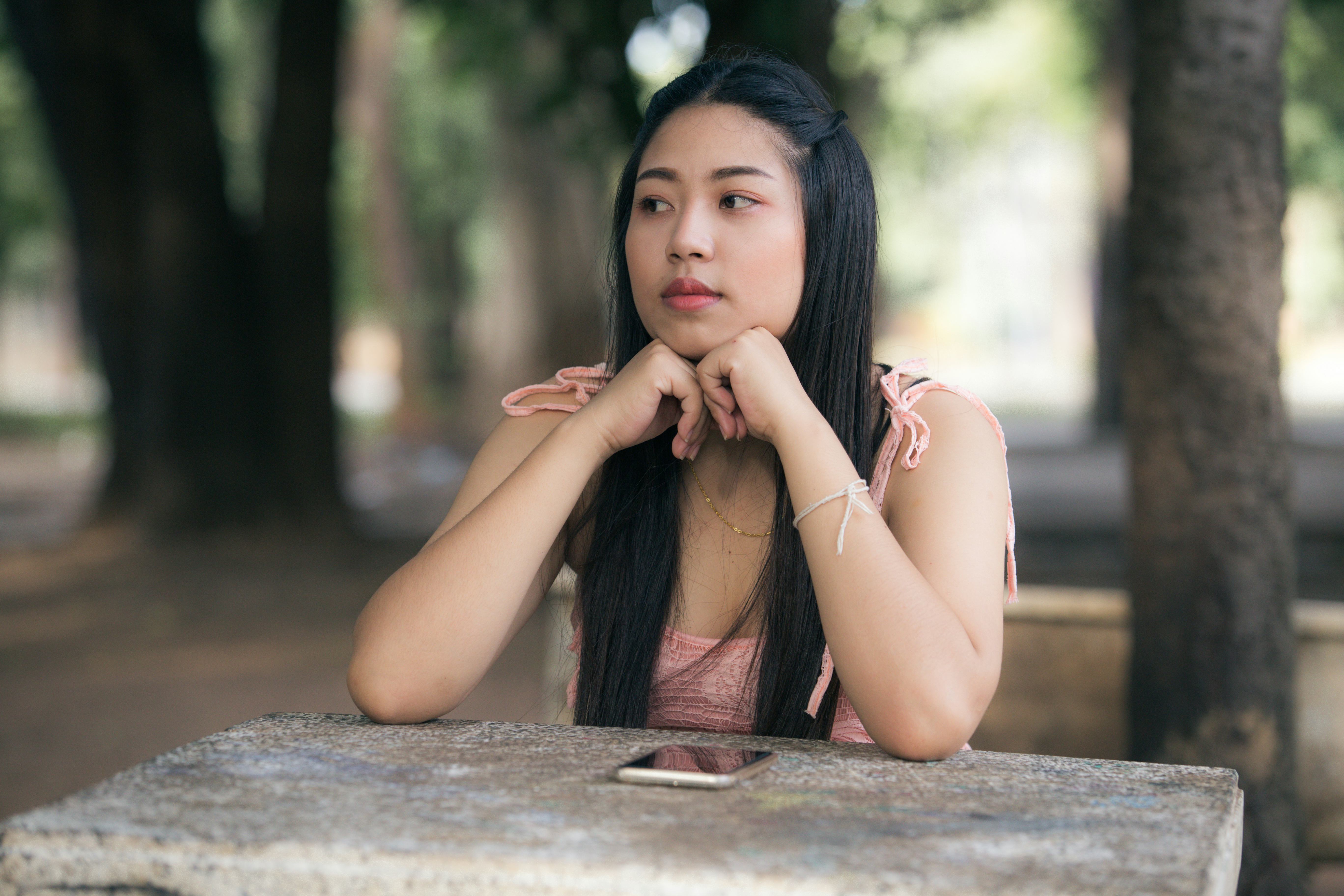 Lonely sad woman and cry in the park