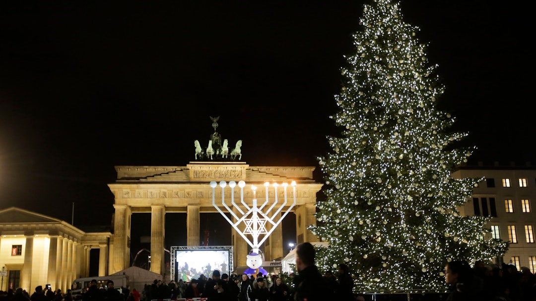 A giant Hanukkah Menorah, center, set up by the Jewish Chabad Educational Center, is illuminated at ...