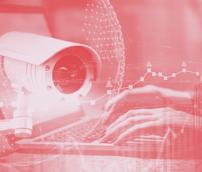 Hands of woman typing on laptop with double exposure of CCTV camera, planet interface and cityscape....