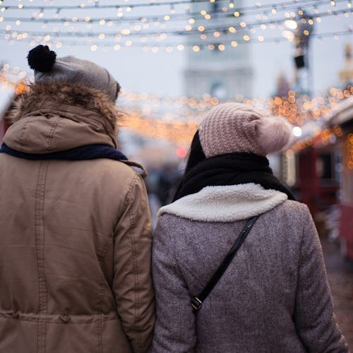 Lovely young couple on Christmas market