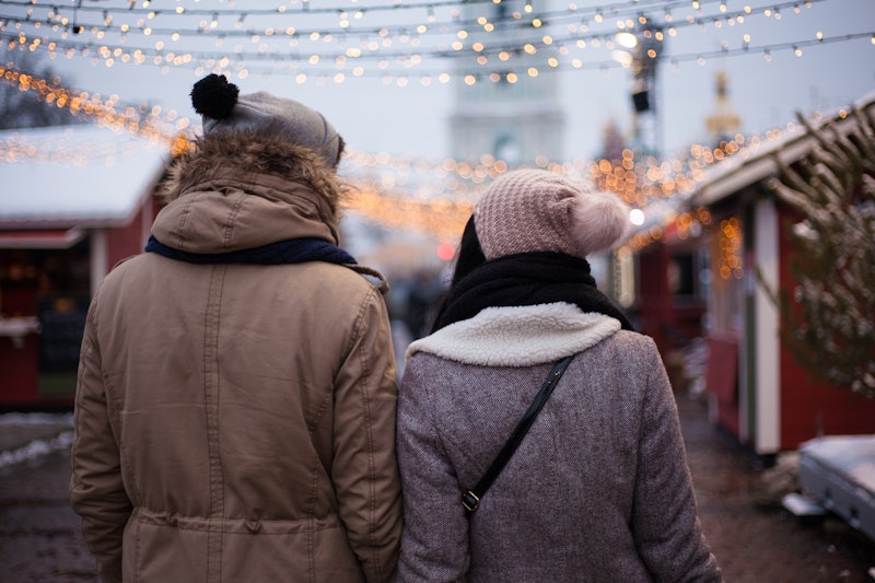 Lovely young couple on Christmas market