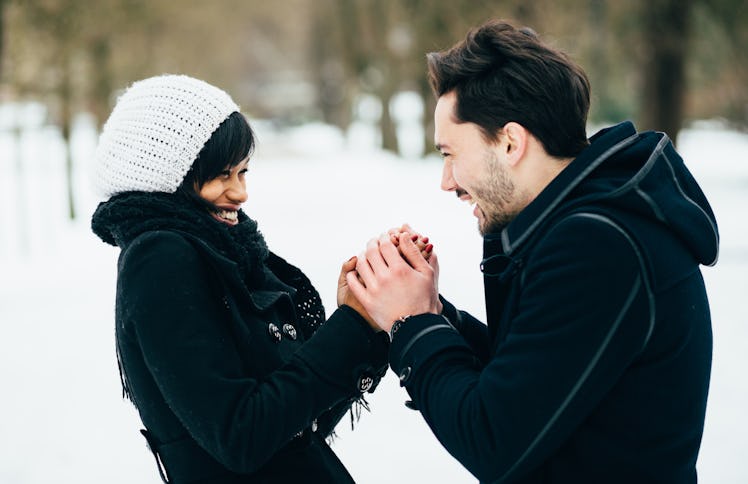 Interracial couple in love having fun in a park