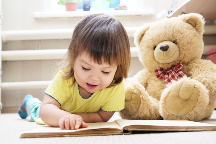 Toddlers "reading" books is the perfect Instagram photo.