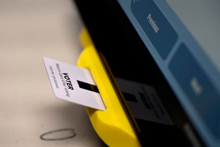 An electronic card with ballot information is seen inserted in a voting machine in Dallas, Ga. While...