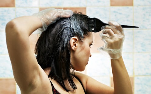 pretty beautiful young woman dyeing hairs
