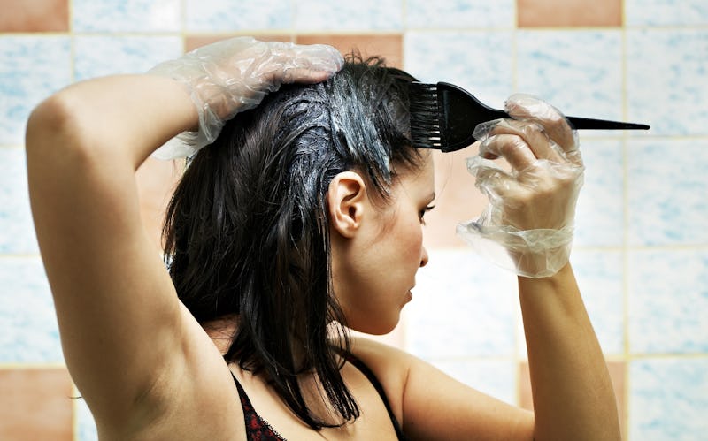 pretty beautiful young woman dyeing hairs