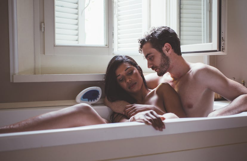 Couple taking bath in a bathtub. Concept about couples and love