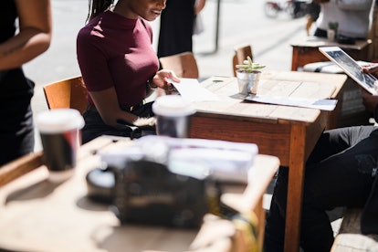 Couple reading the menu at a cafe