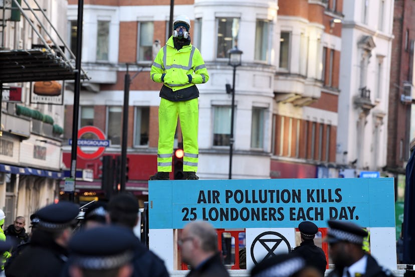 Climate activists at a protest in Cranbourn Street against high air pollution levels in London.