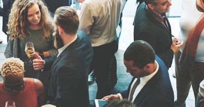 Diverse business people at a dinner party