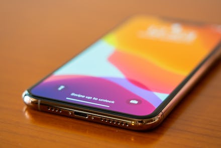 In this photo a new iPhone 11 Pro Max smartphone is seen on a wooden top.