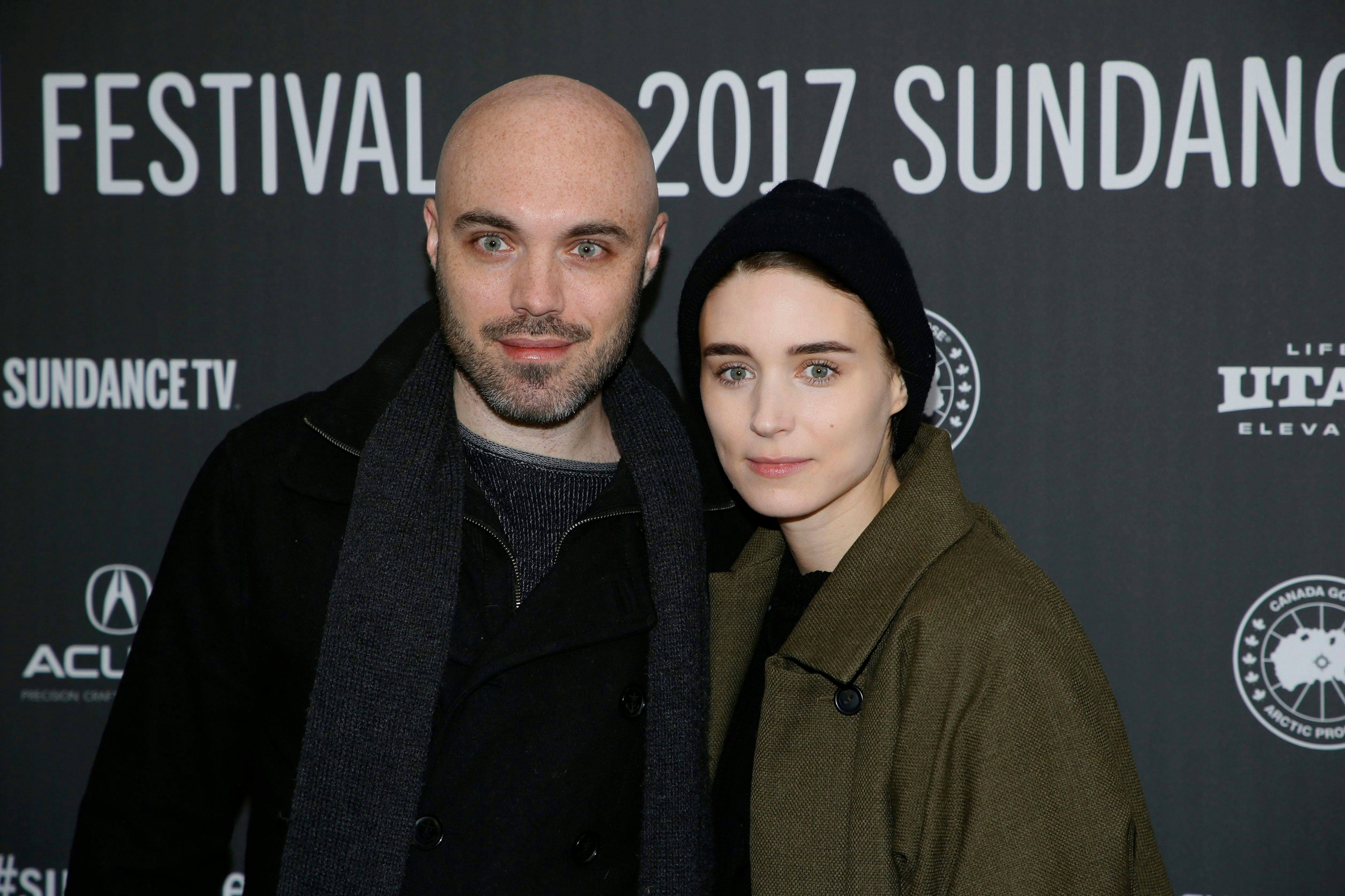 Writer and director David Lowery, left, and actress Rooney Mara, right, pose at the premiere of "A G...