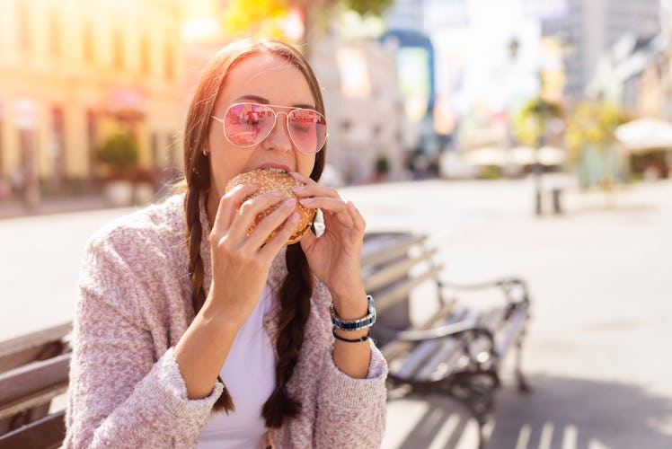 Young woman eating a sandwich