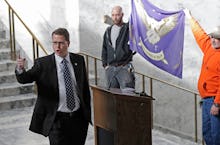 Rep. Matt Shea, left, R-Spokane Valley, gestures as he gives a speech in front of the liberty state ...