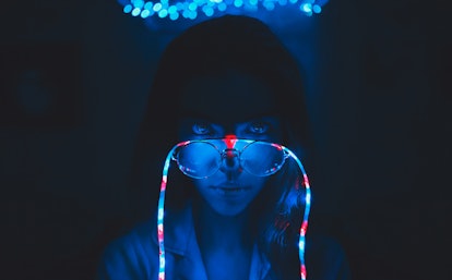 On the girl's glasses garland.  Photo in dark blue