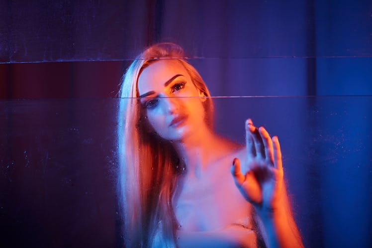 Neon close up portrait of young woman