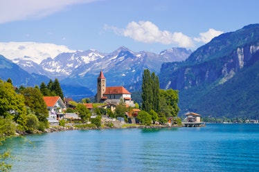 Panoramic view to the Brienz town on lake Brienz by Interlaken, Switzerland. Old fishing town with b...