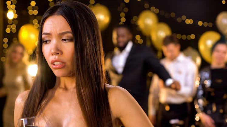 Beautiful female feeling uncomfortable at party, awkward moment, menstruation