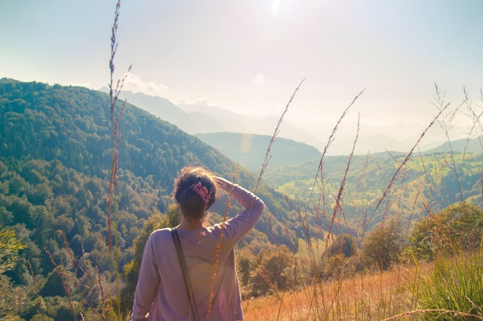 Woman looking far away into nature