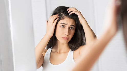 Dandruff Problem. Brunette Girl Looking At Hair Flakes In Mirror Standing In Bathroom. Panorama, Sel...