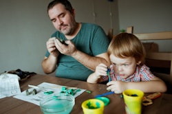 Dad and little boy playing with Play-Doh