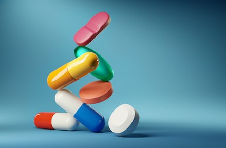 Medical balancing act. A group of medicine pills and antibiotics balacning on top of each other. 3D ...