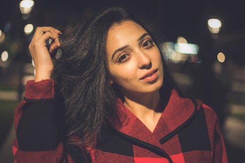 happy woman in night light street background