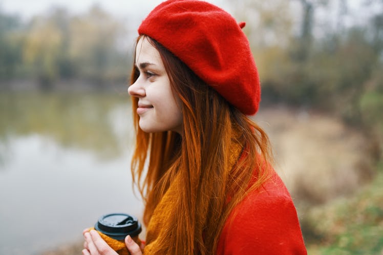    woman with coffee by the lake park silence                            