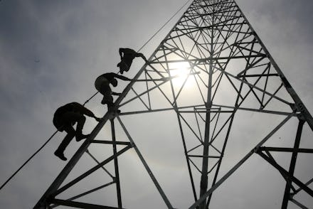 Workers Climb to Install a 60-meters Telecommunication Tower in Banda Aceh Indonesia 27 May 2014 the...