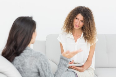 Therapist listening to her talking patient at therapy session