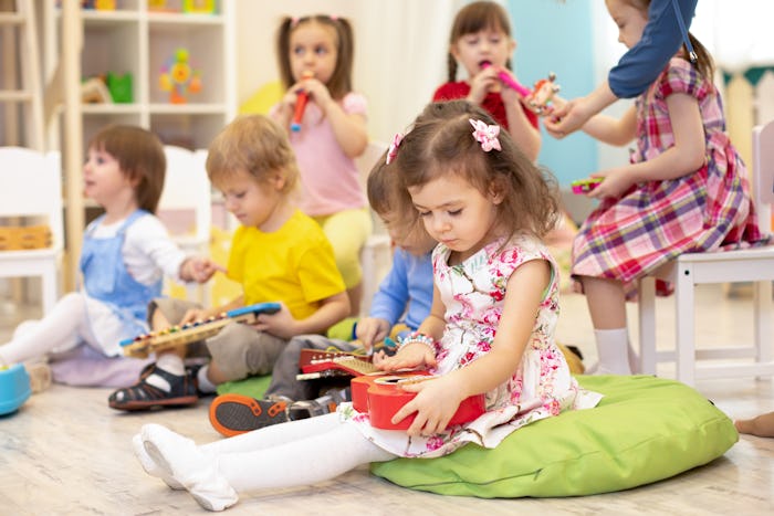 kids playing with musical instruments in a classroom