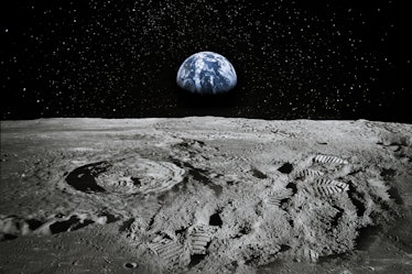 View of Moon limb with Earth rising on the horizon. Footprints as an evidence of people being there ...
