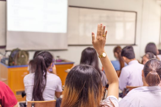Education concept, student raising hand up in the class to ask questions and answer the topic in the...
