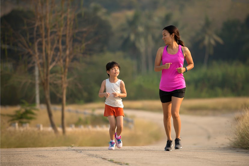 Relax time on summer,Daughter and mother jogging at park, healthy active lifestyle concept