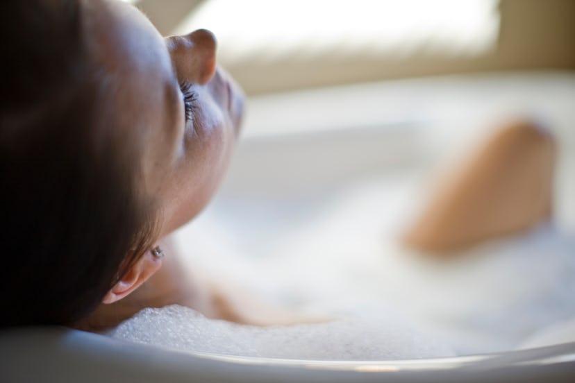 Woman enjoying relaxing bubble bath