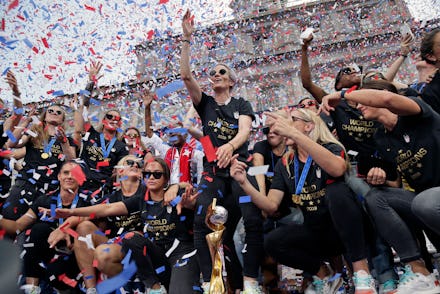 The U.S. women's soccer team, Megan Rapinoe center, celebrates at City Hall after a ticker tape para...